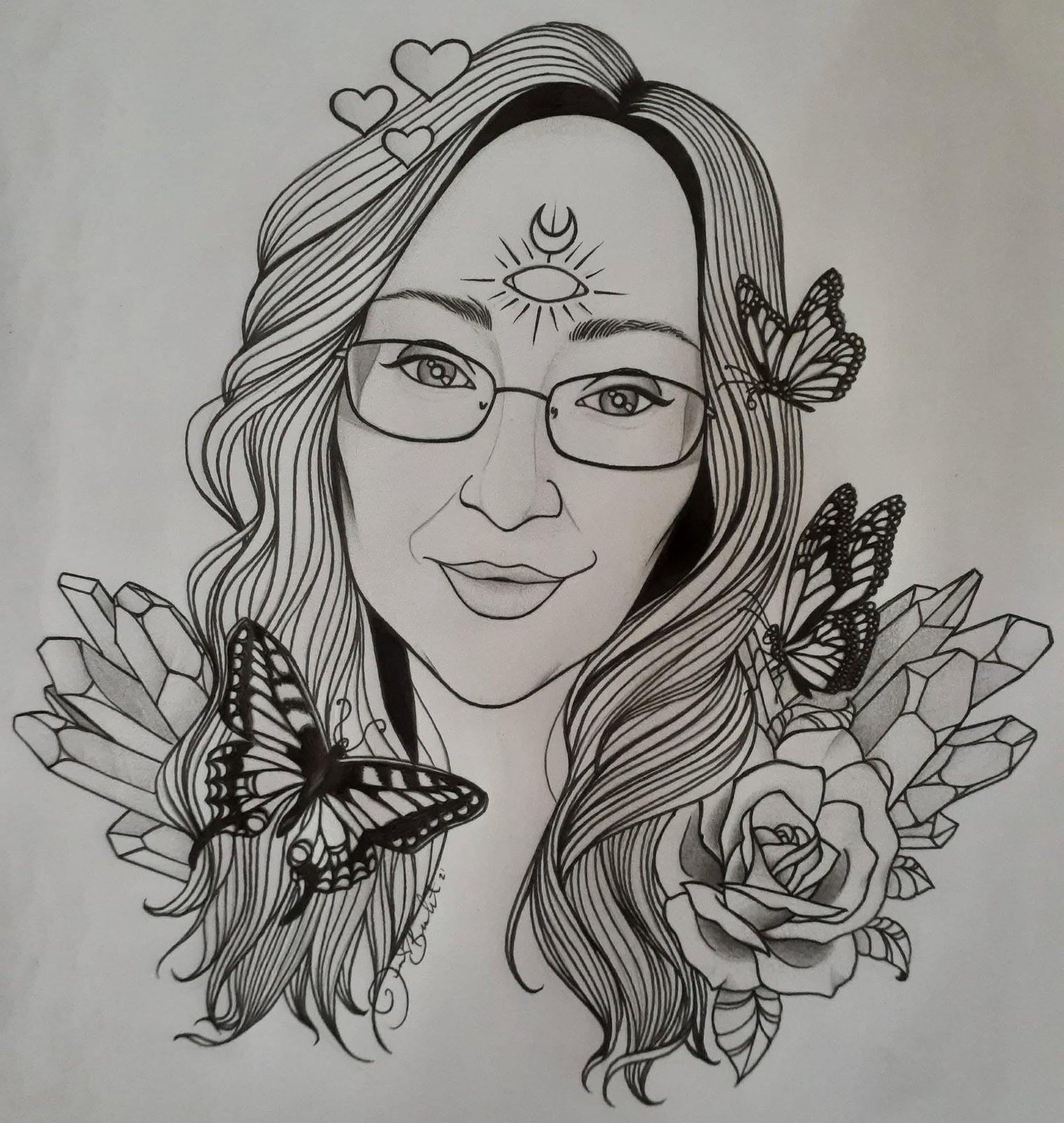 Ink portrait of a smiling woman in glasses with a crescent moon on her brow, butterflies, crystal clusters and a rose drawn around her shoulders