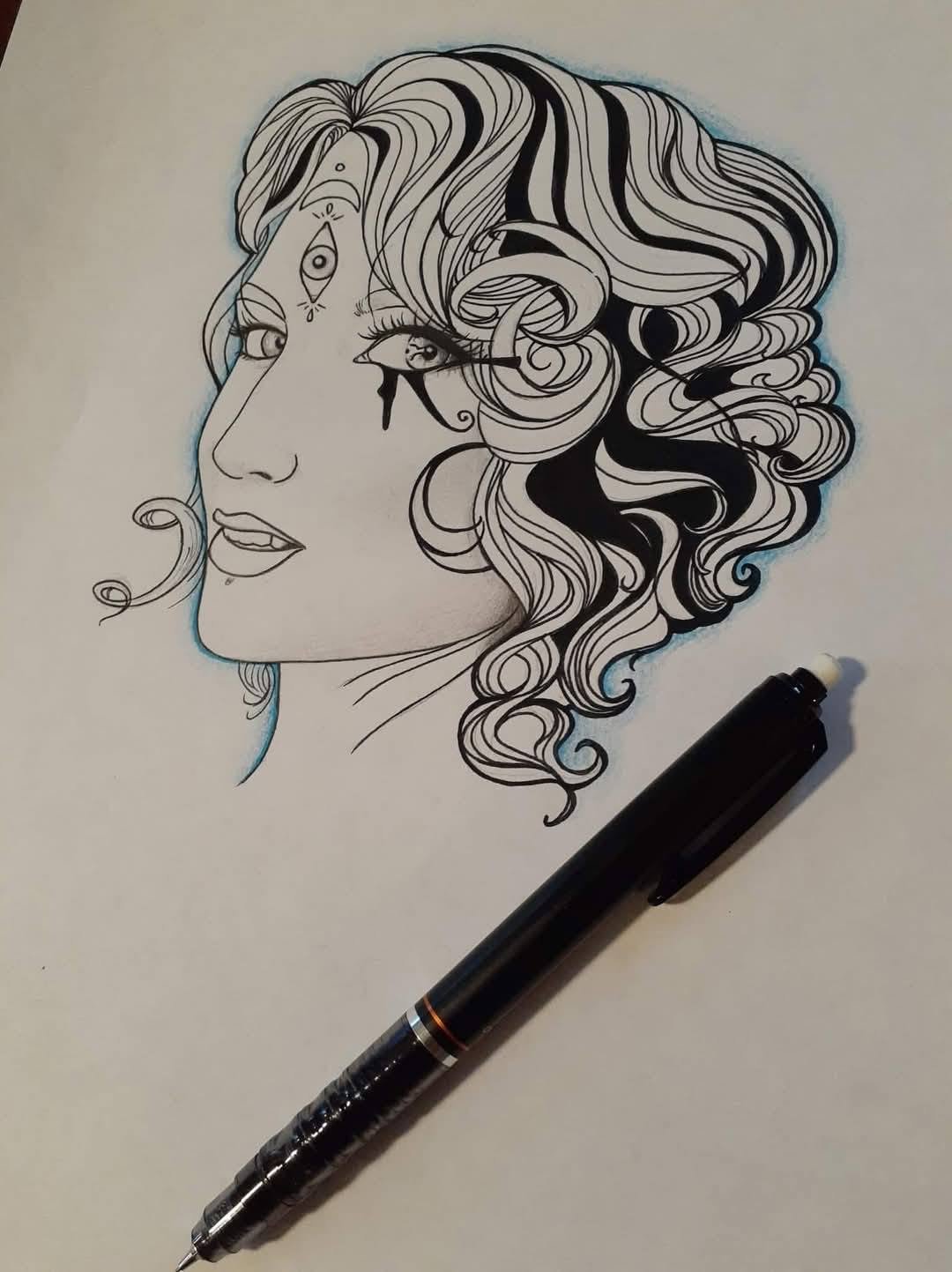 Ink profile of a woman with a mass of loose curls, drawn in clean black line with the pen still resting on the page