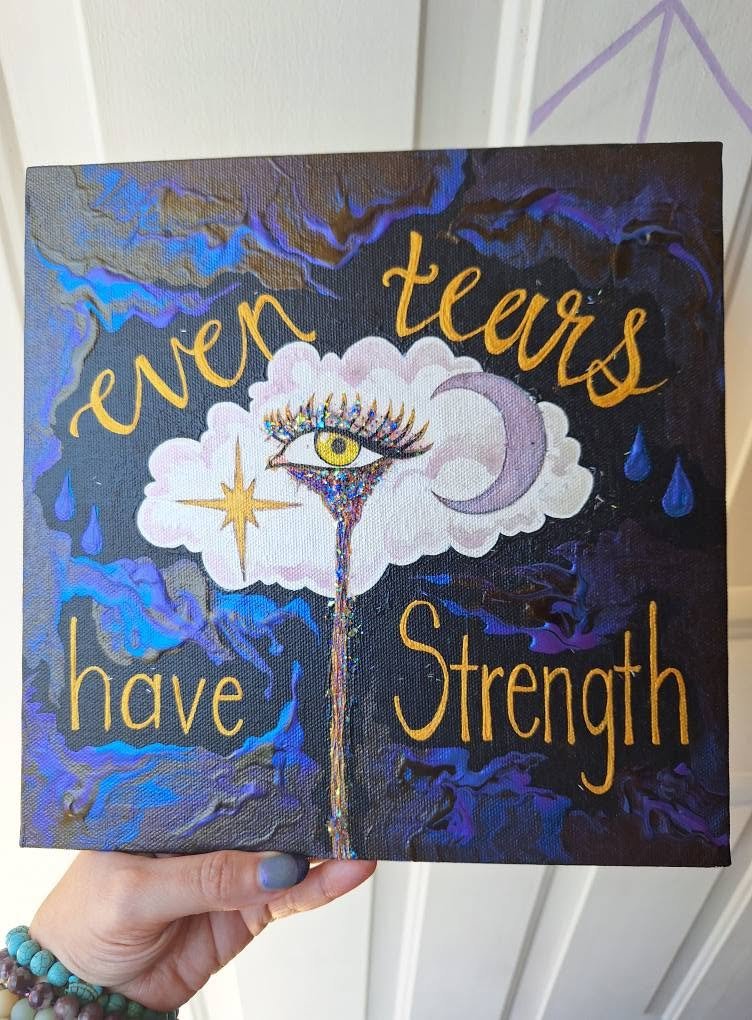 Acrylic painting of an eye in a cloud shedding one long tear, with a crescent moon and stars, lettered 'even tears have strength'