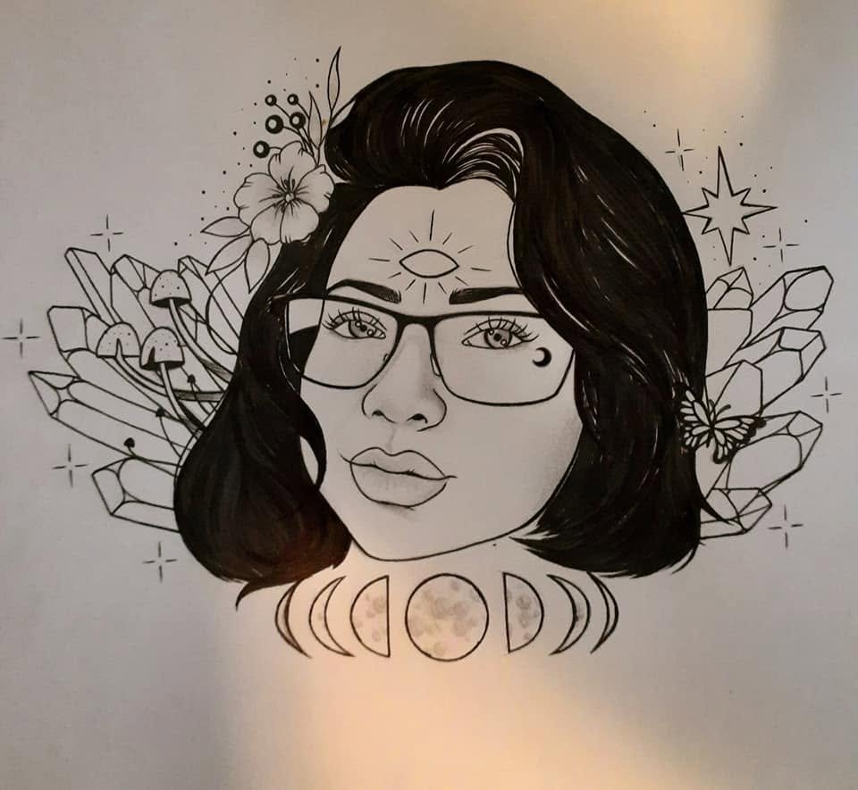 Ink portrait of a woman in glasses with a third eye on her brow, a row of moon phases below her and crystal clusters and flowers at her shoulders