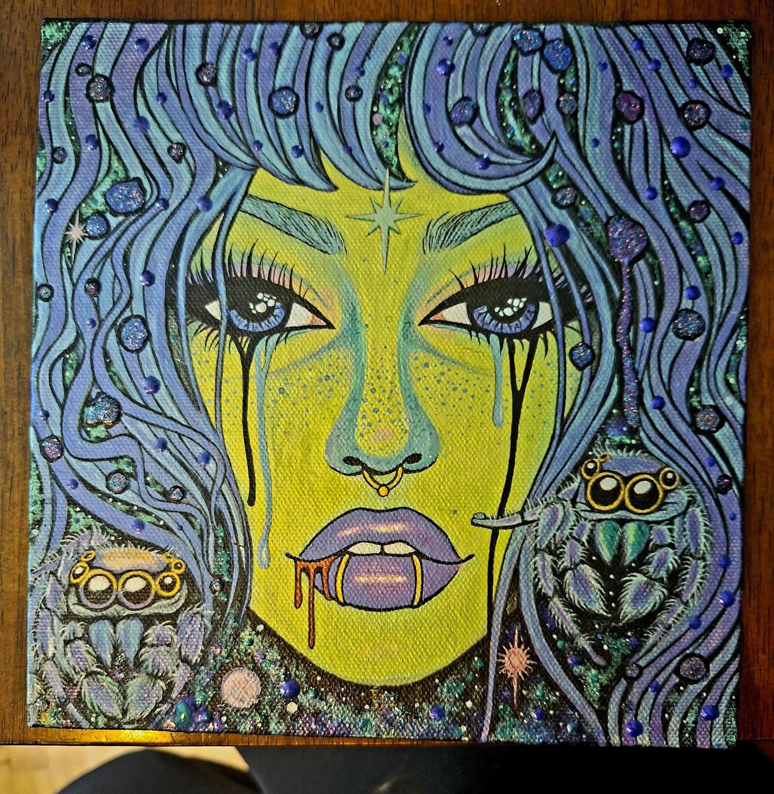 Acrylic painting of a woman with neon yellow-green skin and glittering blue-violet hair, tears running down her face and two jumping spiders perched beside her